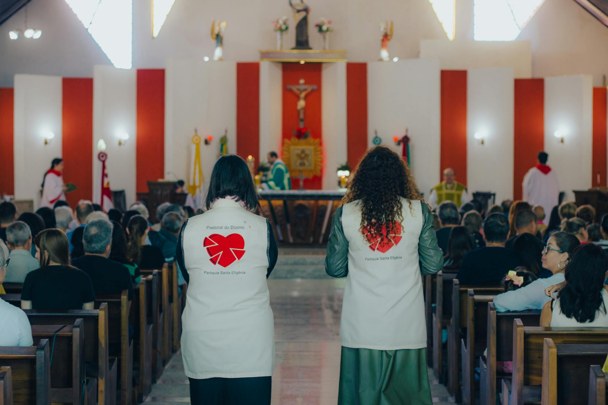 Back View of Women Assisting at a Mass